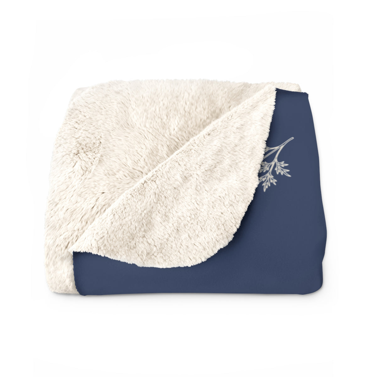 Fluffy cream backing shows at a turned corner of a folded Navy sherpa fleece blanket, beside a cream flower sprig on the front.