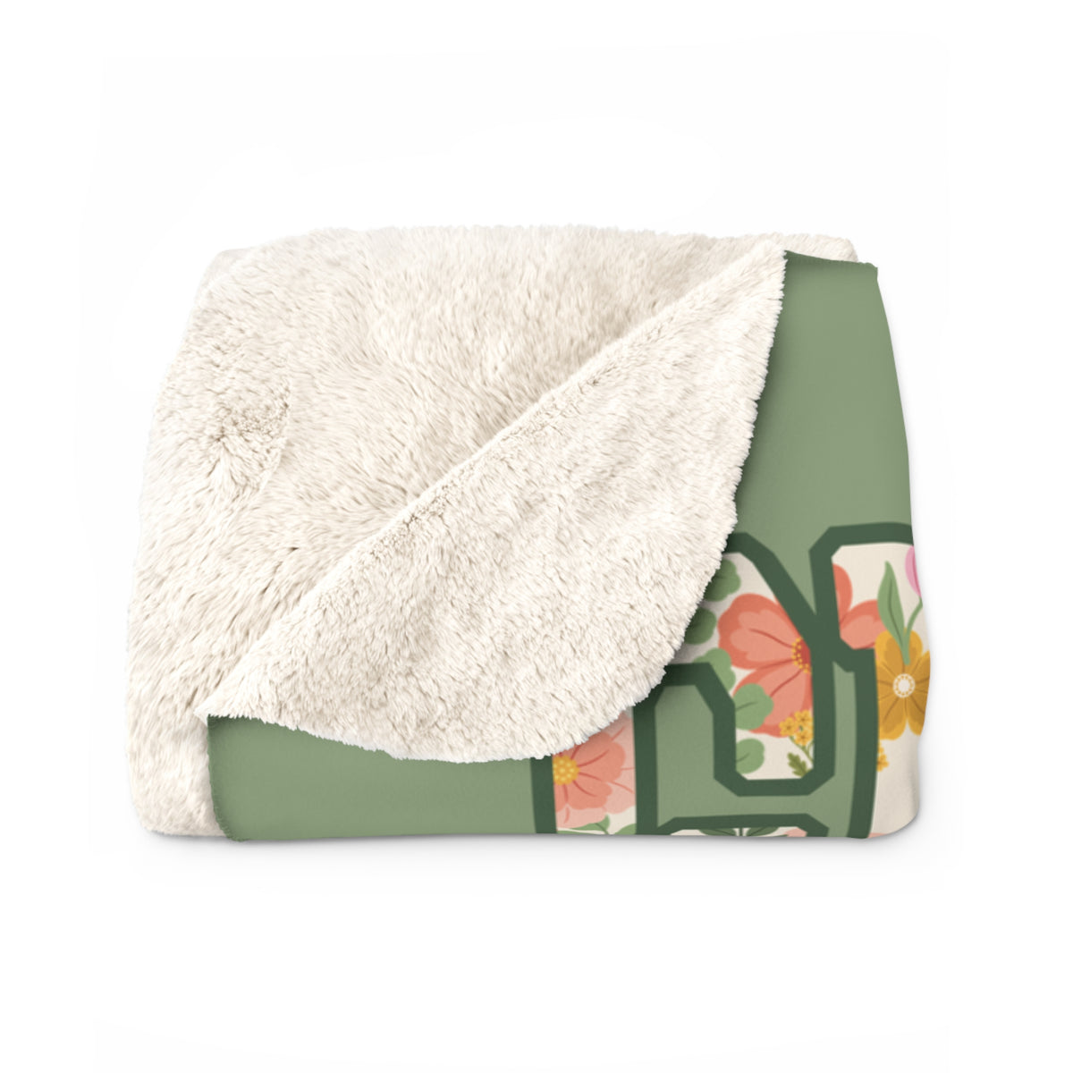 A folded Sage sherpa fleece blanket has a corner turned back, showing its fluffy cream sherpa back beside the floral front.