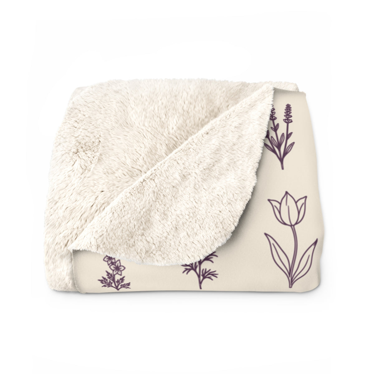 Folded corner of a Cream wildflower blanket in sherpa fleece reveals its fluffy cream back beside a deep plum tulip and lavender stem.