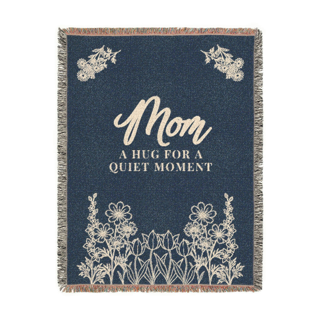 Tall Navy mom throw blanket in woven cotton, 60 x 80 inches, on white with cream "Mom" and "A hug for a quiet moment" above wildflowers.