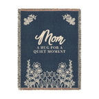 Tall Navy mom throw blanket in woven cotton, 60 x 80 inches, on white with cream "Mom" and "A hug for a quiet moment" above wildflowers.