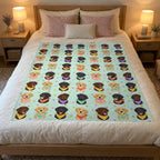 A 50 x 60 inch Mint velveteen plush Lab blanket on a light oak bed with a cream duvet, blush pillows and a glowing lamp.