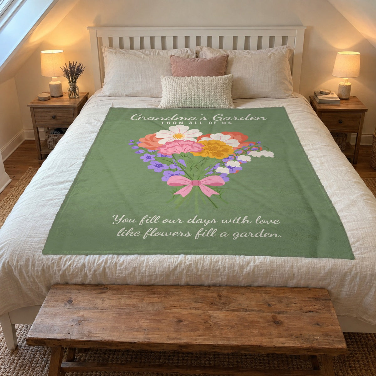 A 50 x 60 inch Sage Grandma's Garden blanket in velveteen plush lies on a white queen bed in an attic bedroom with sloped ceilings.