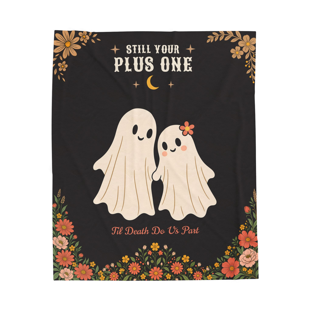 A Black velveteen plush blanket lies flat on white, with a ghost couple below "STILL YOUR / PLUS ONE" and wildflowers beneath.