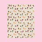 Full pattern on a Cream velveteen plush blanket on a blush backdrop with dachshunds in knit sweaters.