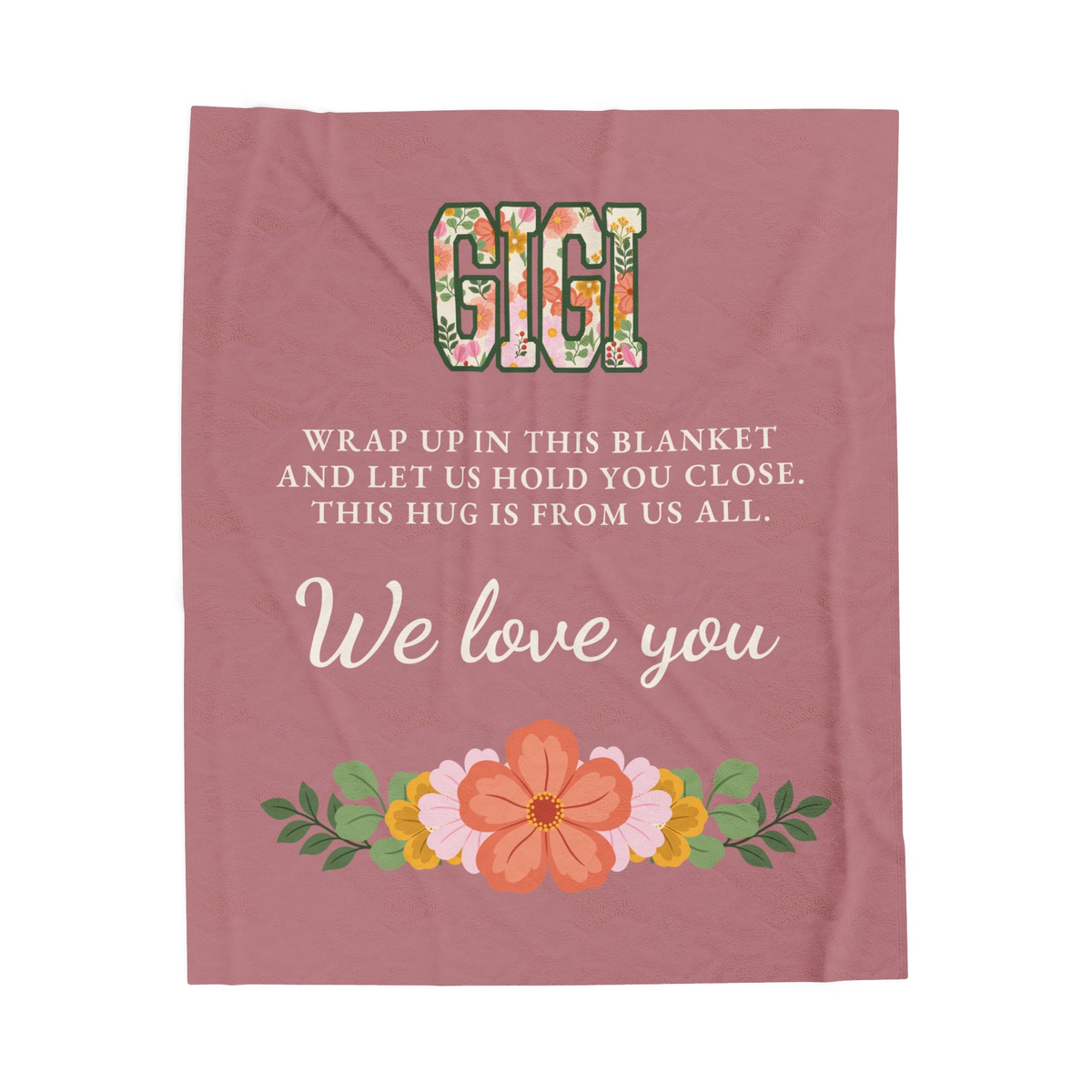 Cream script reading "We love you" sits below floral "GIGI" on a Dusty rose velveteen plush blanket laid flat on white.