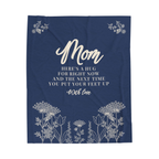Navy Mother's Day blanket in velveteen plush lies flat on white, showing cream words and a meadow with flower sprays in the top corners.