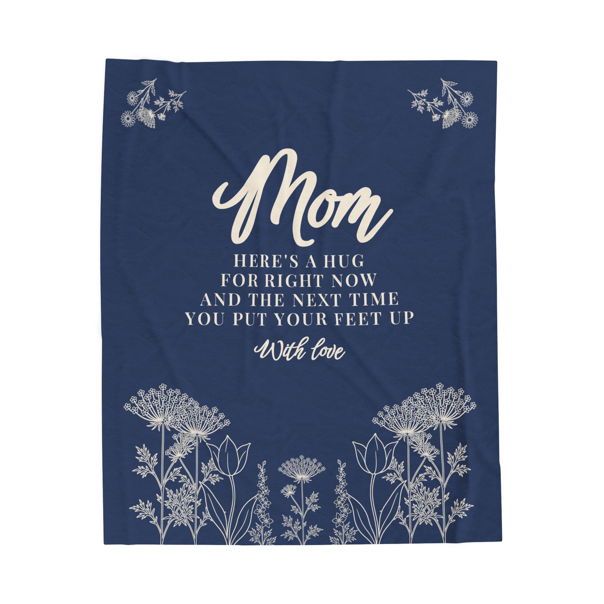 Navy Mother's Day blanket in velveteen plush lies flat on white, showing cream words and a meadow with flower sprays in the top corners.