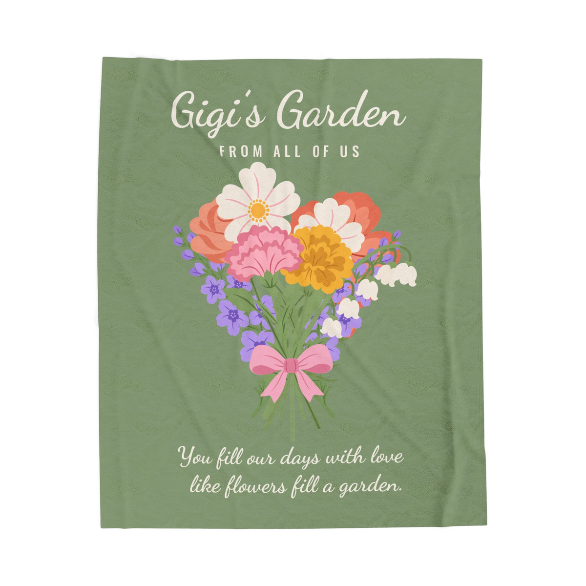 Cream "Gigi's Garden" script tops a Sage velveteen plush blanket laid flat on white, with "FROM ALL OF US" and a tied bouquet below.