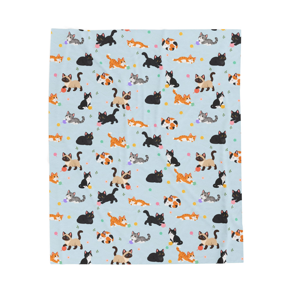 Cartoon cats and pastel yarn balls cover a Sky velveteen plush blanket laid flat on white, with leaf sprigs and small daisies.