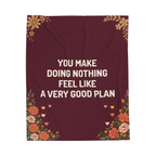Laid flat on white, the Wine velveteen plush blanket reads "You make doing nothing feel like a very good plan" above wildflowers and small hearts.