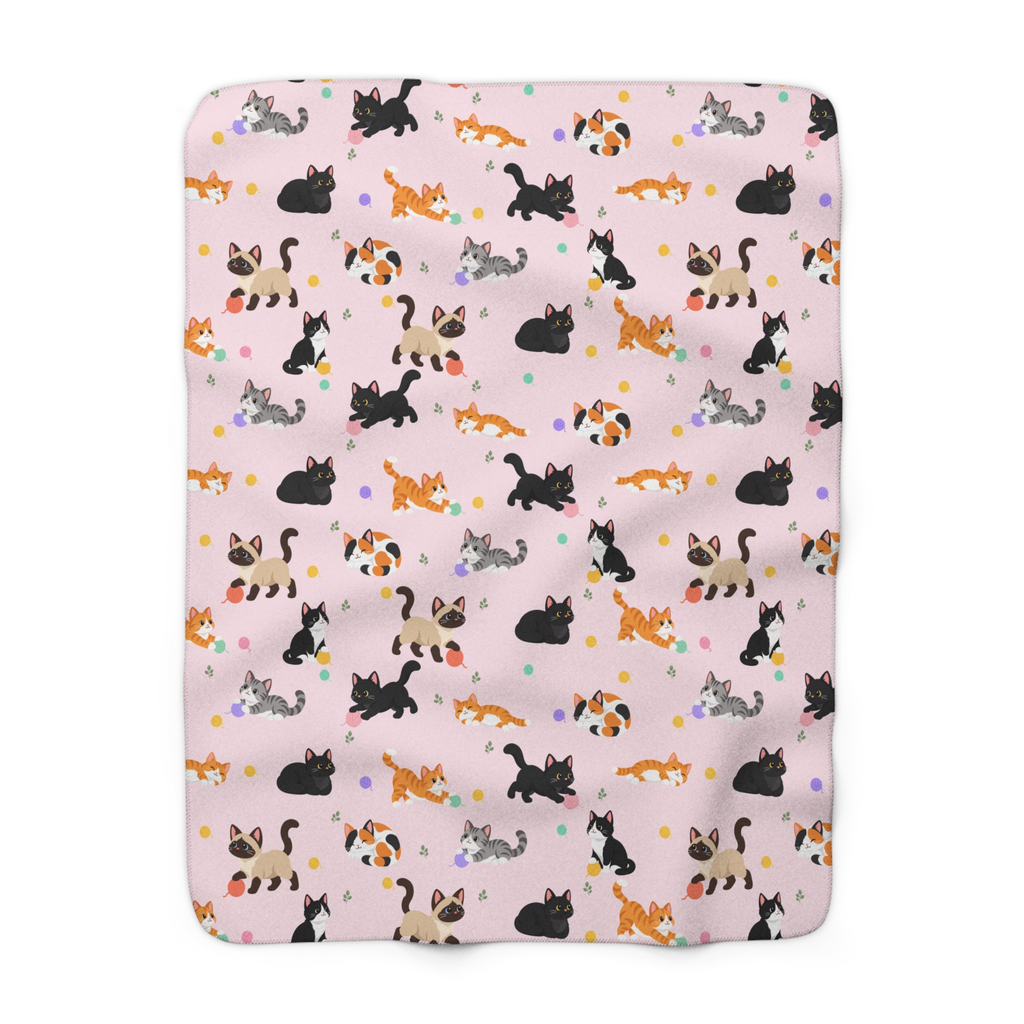 On a white background, a Blush cat sherpa blanket lies flat with cartoon cats and leaf sprigs covering the printed fleece front.