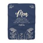 Laid flat on white, a Navy sherpa fleece blanket for Mom shows cream "Mom" lettering, a wildflower meadow and sprays in both top corners.