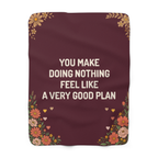 Rounded corners frame a Wine valentines blanket in sherpa fleece laid flat on white, with bold cream words, wildflowers and small hearts.