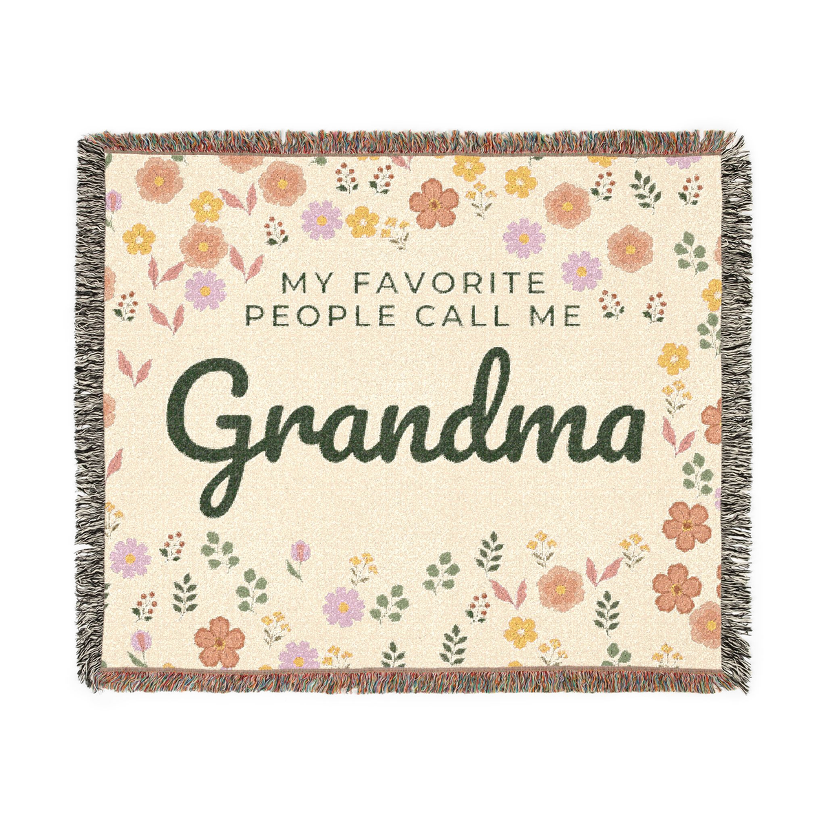 Cream floral throw blanket in woven cotton lies flat on white, with "MY FAVORITE PEOPLE CALL ME Grandma", little flowers and leaves, and fringe on all sides.