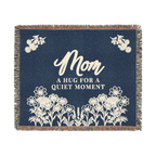 A Navy mom throw blanket in woven cotton lies flat on white, measuring 60 x 50 inches with cream words and flowers and fringe on all edges.
