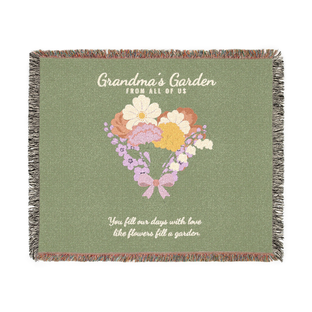 Sage flower throw blanket in woven cotton lies flat on white: "Grandma's Garden", a bouquet of flowers tied with a bow and fringe on all four sides.